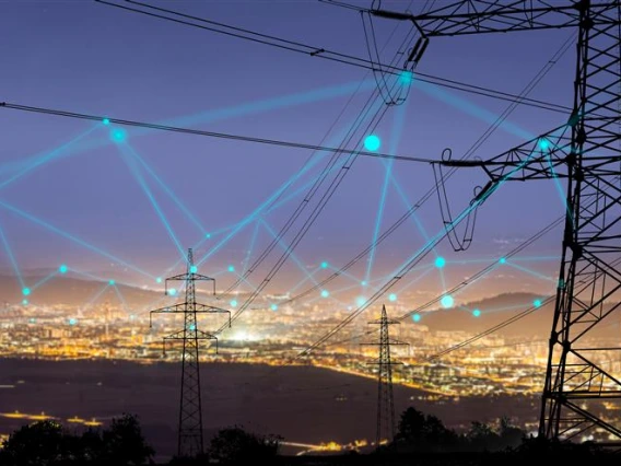 a digital overlay showing the energy demands of a city seen from afar