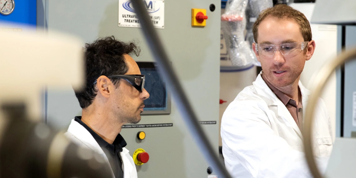 two scientists talking at lab