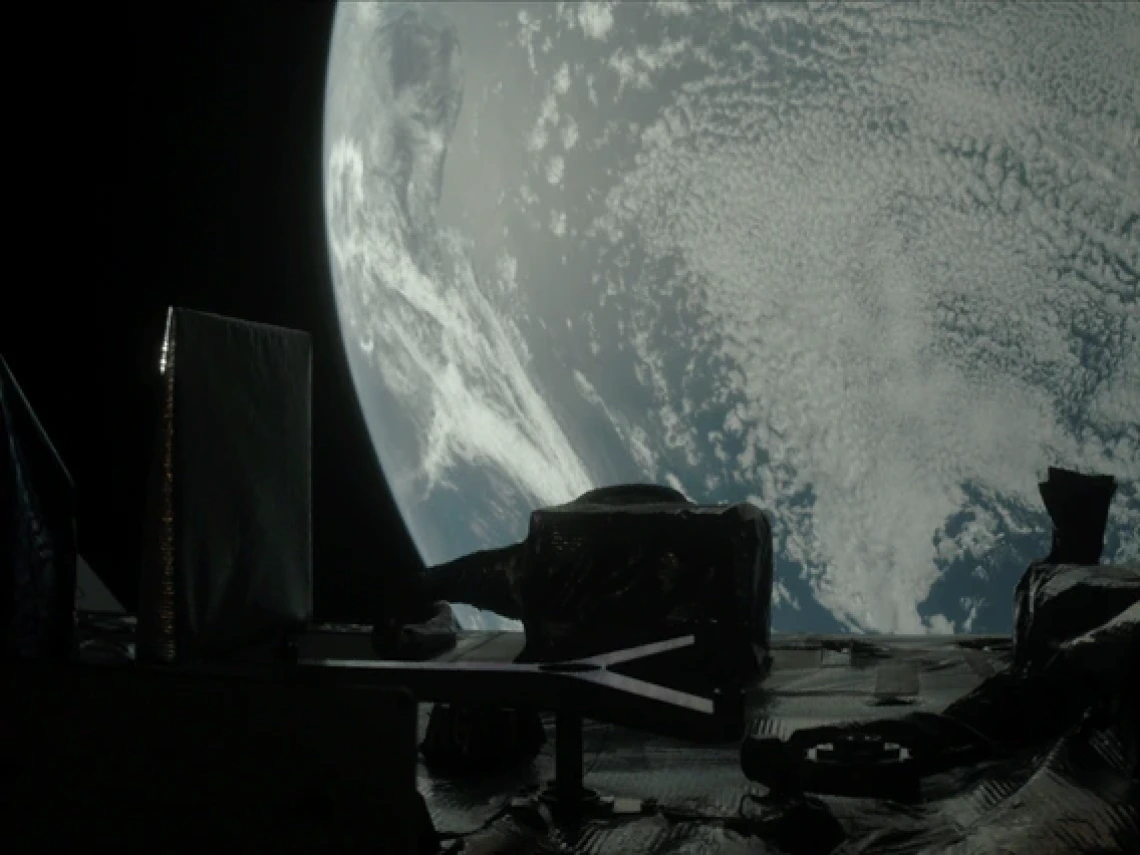 Earth fills most of the image, a moody blue globe mostly covered with tiny blueish white clouds like carpet pile or sheep’s wool. In the foreground, the instrument panel is dark enough to be nearly in silhouette, like a city skyline. A tall thin rectangle juts up from the left side of the panel, like a tall building, which is part of the SamCam. In the center, a shorter, squatter polygon shape is the OLA instrument. A slightly lighter colored Y shape lays on its side in front of the OLA.